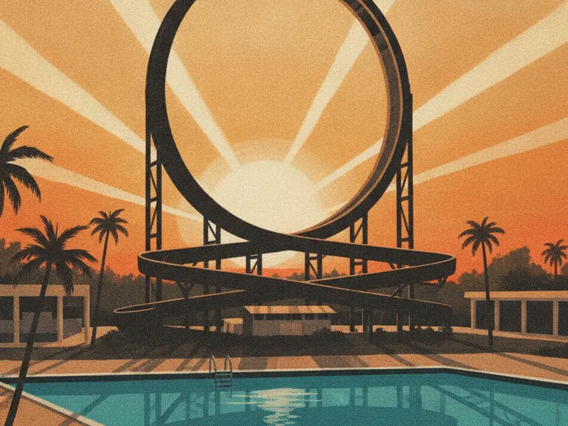 A towering waterslide with a full vertical loop silhouetted against a dramatic sunset.