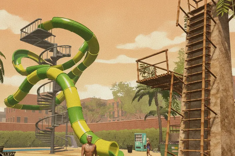 The Mega Looper's green loop rising beside the climbing tower on the sand.